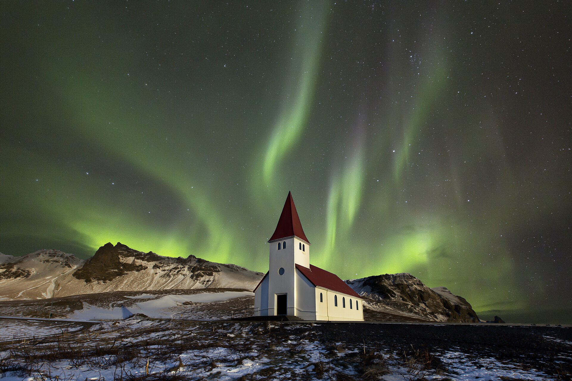 Northern lights over a small church near Vik, Iceland